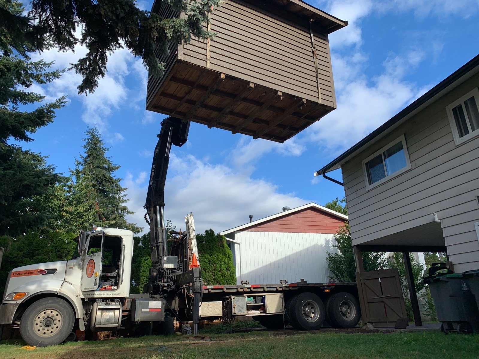 Backyard shed lifted over the house